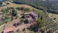 Rolling Hills Italy - Rustic farmhouse for sale surrounded by greenery in Asciano.