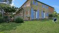 Rolling Hills Italy - For sale elegant farm house in stone and brick in Lucignano.