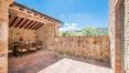 Rolling Hills Italy - Lovely farmhouse with swimming pool for sale in Radicondoli.