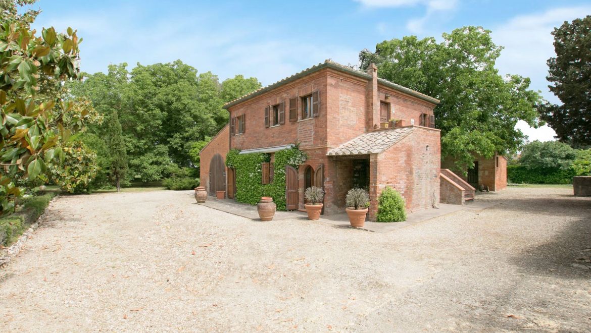 Rolling Hills Italy - Historic brick country house in Montepulciano, Siena.
